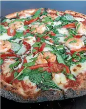  ?? BRETT ATKINSON ?? The Master & Margherita’s chilli prawn pizza evokes the tastes and smells of Naples.