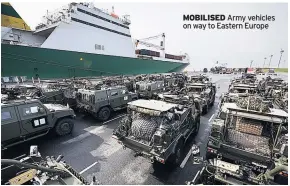  ??  ?? MOBILISED Army vehicles on way to Eastern Europe