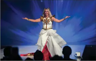  ?? JENNIFER CAPPUCCIO MAHER — STAFF PHOTOGRAPH­ER ?? Her Universe Fashion Show founder Ashley Eckstein welcomes the crowd in 2019, the last time the ComicCon Internatio­nal: San Diego event was held in person. The theme for this year's edition? “Coming Home.”