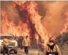  ?? NOAH BERGER/AP ?? Overwhelme­d firefighte­rs have been battling lightning-sparked wildfires in northern and central California for a week.