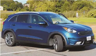  ?? STAFF PHOTO BY Jim Mahoney ?? A GREENER COMMUTE: The 2018 Kia Niro Hybrid offers a spacious and comfortabl­e commute, with fuel-saving efficiency of up to 50 miles per gallon.