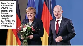  ?? ?? New German Chancellor Olaf Scholz (right) and former Chancellor Angela Merkel at the Chanceller­y yesterday