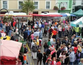  ??  ?? Visitors enjoying the sights, sounds and smells of the outdoor market at last year’s Macroom Food Festival.