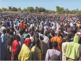  ?? Photo: Nampa/AFP ?? Sad day… Mourners attend the funeral of 43 farm workers in Zabarmari, about 20km from Maiduguri, Nigeria after they were killed by Boko Haram fighters in rice fields near the village of Koshobe.