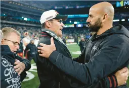  ?? ADAM HUNGER/AP ?? Commanders coach Ron Rivera, left, greets Jets coach Robert Saleh after Sunday’s game in East Rutherford, New Jersey.