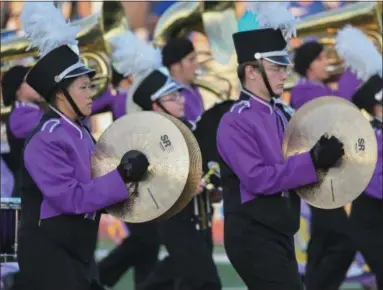  ?? ERIC BONZAR — THE MORNING JOURNAL ?? Percussion­ists Ivy Yip, left, and Aiden Purcell crash their cymbals as they march on to the football field Sept. 22, with the Avon Eagles Marching Band.