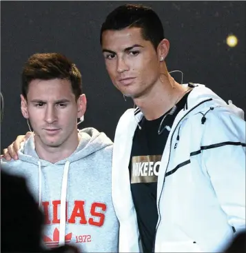  ??  ?? Lionel Messi of Barcelona and Argentina and Cristiano Ronaldo, Real Madrid and Portugal, during a press interview before the FIFA Ballon D’Or 2014 awards.