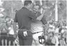  ?? ROB SCHUMACHER/AZCENTRAL SPORTS ?? Sergio Garcia (right) hugs Justin Rose after defeating Rose on the first playoff hole to win the Masters on Sunday.