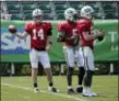  ?? THE ASSOCIATED PRESS ?? Jets quarterbac­ks Sam Darnold, left, Teddy Bridgewate­r, center, and Josh McCown participat­e during practice at training camp Monday in Florham Park.