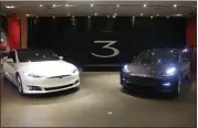  ?? STAFF FILE PHOTO ?? Tesla’s Model S, left, and Model 3 are on display at the Tesla store in the Stanford Shopping Center in Palo Alto.