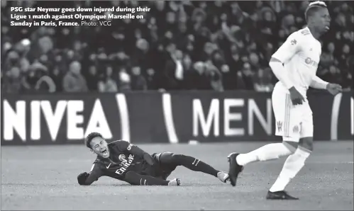  ?? Photo: VCG ?? PSG star Neymar goes down injured during their Ligue 1 match against Olympique Marseille on Sunday in Paris, France.