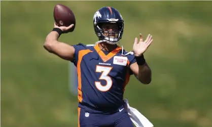  ?? ?? Denver Broncos quarterbac­k Russell Wilson takes part in drills at the team's voluntary minicamp last month. Photograph: David Zalubowski/AP