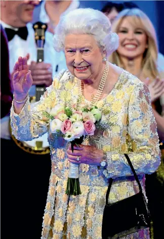  ?? PHOTO: AP ?? Queen Elizabeth II waves on stage at the Royal Albert Hall in London after a concert to celebrate her 92nd birthday.