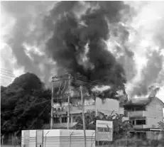  ??  ?? The girls’ hostel on fire at SMK Tandek yesterday.