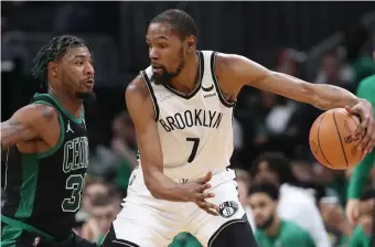  ?? ?? STAR TREATMENT: Nets forward Kevin Durant, right, is guarded by Marcus Smart during the third quarter of the Celtics’ win in Game 1 of their Eastern Conference playoff series with Brooklyn.