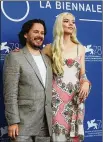  ?? FILIPPO MONTEFORTE/ AFP VIA GETTY IMAGES/TNS ?? Director Edgar Wright and actress Anya Taylor-Joy attend a photo call for the film “Last Night in Soho” presented out of competitio­n on Sept. 4 during the 78th Venice Film Festival at Venice Lido.