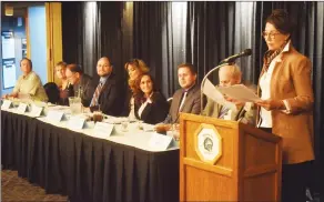  ?? NEWS PHOTO TIM KALINOWSKI ?? SD76 trustee candidates listen as fellow candidate Deborah Forbes speaks to the crowd Wednesday night at the ATA Local No. 1 debate at the Medicine Hat Golf and Country Club.