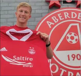  ??  ?? Ross McCrorie (above) after signing for Aberdeen and (left) during his spell at Ibrox