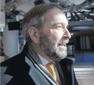  ?? C H R I S Y O U NG / T H E C A NA D I A N P R E S S ?? Michael Den Tandt says NDP leader Tom Mulcair is trying to refocus attention on the economy, where his party believes the Conservati­ve government is increasing­ly vulnerable.