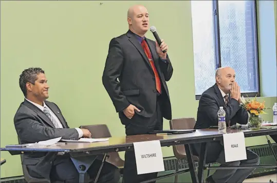  ?? Photos by Lori Van Buren / Times Union ?? From left, Rodney Wiltshire Jr., Thomas Reale and Troy Mayor Patrick Madden participat­e in a mayoral debate Tuesday in Troy.