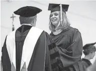  ?? JEFF KERNEN ?? Fond du Lac’s Jeanna Giese-Frassetto accepts her diploma at Lakeland College in 2011.