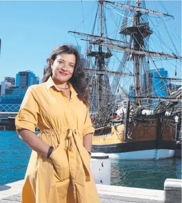  ?? Picture: DAVID SWIFT ?? ‘THRILLED’: Alison Page with the replica of James Cook’s Endeavour, which will sail around Australia next year, the 250th anniversar­y of Cook’s visit.