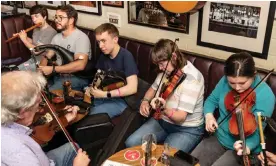  ?? Photograph: Julie-Ann Rouquette/Belfast
TradFest ?? ‘We are trying to normalise all these things that were perceived to be for the other’ … a pub performanc­e as part of TradFest in Belfast.