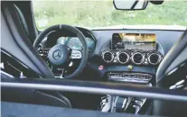  ??  ?? The Mercedes-amg GT R's interior coddles the driver.