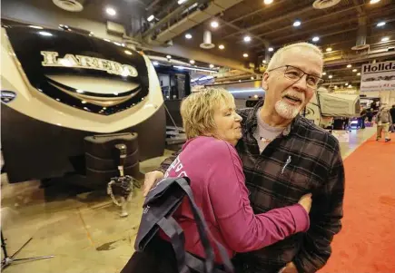  ?? Steve Gonzales / Houston Chronicle ?? Alaina and Pete Kurz, who have lived in a trailer for over five months after Cypress Creek flooded their home northwest of Houston, are in the market for a new vehicle at the Houston RV Show. “We’ve learned we can live with each other in tight spaces,”...