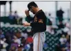  ?? MATT YORK — THE ASSOCIATED PRESS ?? San Francisco Giants starting pitcher Nick Tropeano adjusts his cap after giving up a home run against the Chicago Cubs during the first inning of a spring training game Friday in Mesa, Ariz.