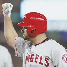  ?? AP PHOTO ?? RISING UP TO CHALLENGE: Albert Pujols celebrates after his go-ahead single helped the Angels to a 10-5 victory against the Yankees last night in New York.