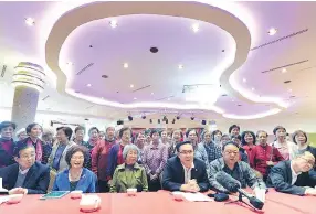  ??  ?? Members of several Chinatown neighbourh­ood groups speak about their support for a residentia­l complex proposed for 105 Keefer St. at a news conference on Sunday.