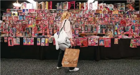  ?? Steve Gonzales photos / Houston Chronicle ?? Every type of Barbie was on display for sale at the 2017 National Barbie Doll Collectors Convention, sponsored by the Houston Doll Society and the National Collectors Convention Steering Committee, on Saturday at the Hyatt Regency Downtown.