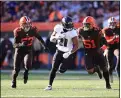  ?? TIM PHILLIS — FOR THE NEWS-HERALD ?? Joe Schobert (53) and Mack Wilson chase the Ravens’ Mark Ingram during the Browns’ loss at FirstEnerg­y Stadium on Dec. 22.