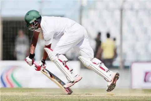  ??  ?? CHITTAGONG: Bangladesh’s Tamim Iqbal defenses a yorker ball during the second day of their first cricket test match against England in Chittagong, Bangladesh, yesterday. — AP
