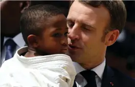  ??  ?? Emmanuel Macron during a 2019 visit to Ivory Coast, in which he said the mistakes of colonialis­m had been ‘grave’. Photograph: Luc Gnago/Reuters