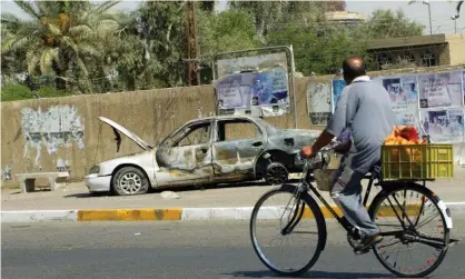  ?? Photograph: Ali Youssef/AFP/Getty Images ?? A burnt-out car in Baghdad after the deadly incident in September 2007.