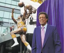  ?? Reed Saxon / Associated Press 2018 ?? Elgin Baylor, who played his entire career with the Lakers, stands near a statue honoring him outside Staples Center.