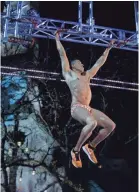  ??  ?? “American Ninja Warrior” contestant Mike Wright of Knoxville competes in the show's Indianapol­is Finals round. MICHAEL HICKEY/NBC