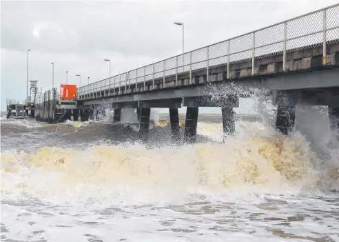  ??  ?? VALUABLE INSIGHTS: A cyclone in the Coral Sea whips up high seas at Palm Cove in 2014. Residents of the suburb are being asked to share local knowledge and photos of flooding events to help create a new drainage management plan.