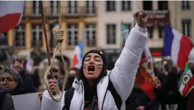  ?? ?? Hundreds of people marched in Lyon, France on Sunday, to honour an Iranian- Kurdish man who took his own life in a desperate act of anguish over the nationwide protests in Iran