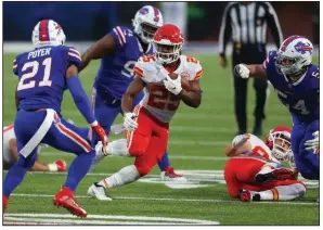  ?? (AP/Jeffrey T. Barnes - right) ?? RIGHT Running back Clyde Edwards-Helaire (center) runs the ball for Kansas City during the first half against the Buffalo Bills in Orchard Park, N.Y. Edwards-Helaire rushed for 161 yards to help the Chiefs in a 26-17 victory to rebound from their first loss of the season.