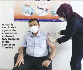  ??  ?? A man is vaccinated against the coronaviru­s at Ankara City Hospital, in the capital on Tuesday