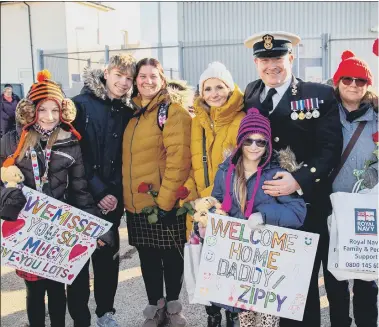  ?? ?? ‘INCREDIBLE ACHIEVEMEN­T’ Above and clockwise, Wightman family with Chief petty officer Victor (Zippy); Crew members embrace family; Steph Leonard with husband Lt Cdr Tom Leonard and their children Penny, seven, and Sebby, four; Jackie McFarlane, with son, Peter and Irene McFarlane; Commander Matthew Marriott; Delighted crew members step off HMS Diamond