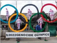  ??  ?? Exiled Tibetans protesting China hosting the Games