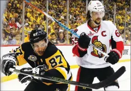  ?? AP PHOTO ?? Sidney Crosby and the Pittsburgh Penguins are tied 1-1 in their series against Erik Karlsson and the Ottawa Senators. Game 3 is tonight in Ottawa.