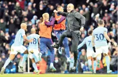  ?? — AFP photo ?? Manchester City’s Spanish manager Pep Guardiola celebrates after Manchester City’s English midfielder Raheem Sterling scores his team’s second goal during the English Premier League football match between Manchester City and Southampto­n at the Etihad...