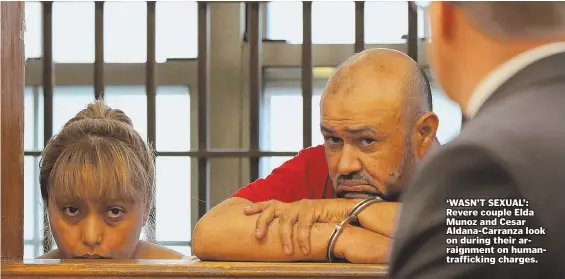  ?? HERALD PHOTO BY MARK LORENZ ?? ‘WASN’T SEXUAL’: Revere couple Elda Munoz and Cesar Aldana-Carranza look on during their arraignmen­t on humantraff­icking charges.