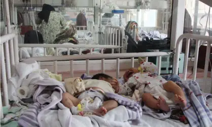  ??  ?? Babies who survived the attack receive medical care at another hospital in Kabul. Photograph: Anadolu Agency via Getty Images