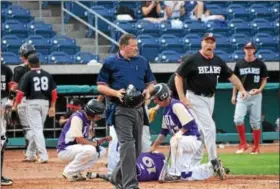  ?? AUSTIN HERTZOG - DIGITAL FIRST MEDIA ?? Todd Moyer wants to have a word with the plate umpire after a play at the plate left Plum’s Alex Kirilloff (19) on the ground in the third inning. Kirilloff collided with Boyertown catcher Ryan Weller as he attempted an inside-the-park home run.